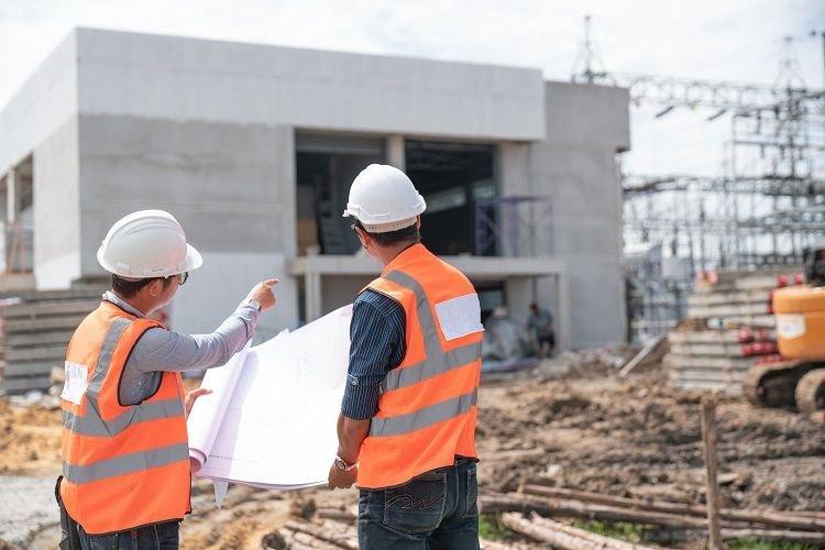 Construction workers reviewing plans